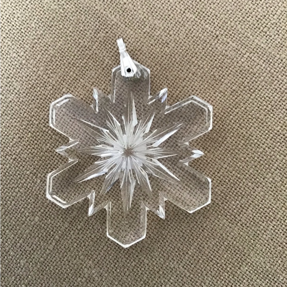Large clear glass snowflake pendant.